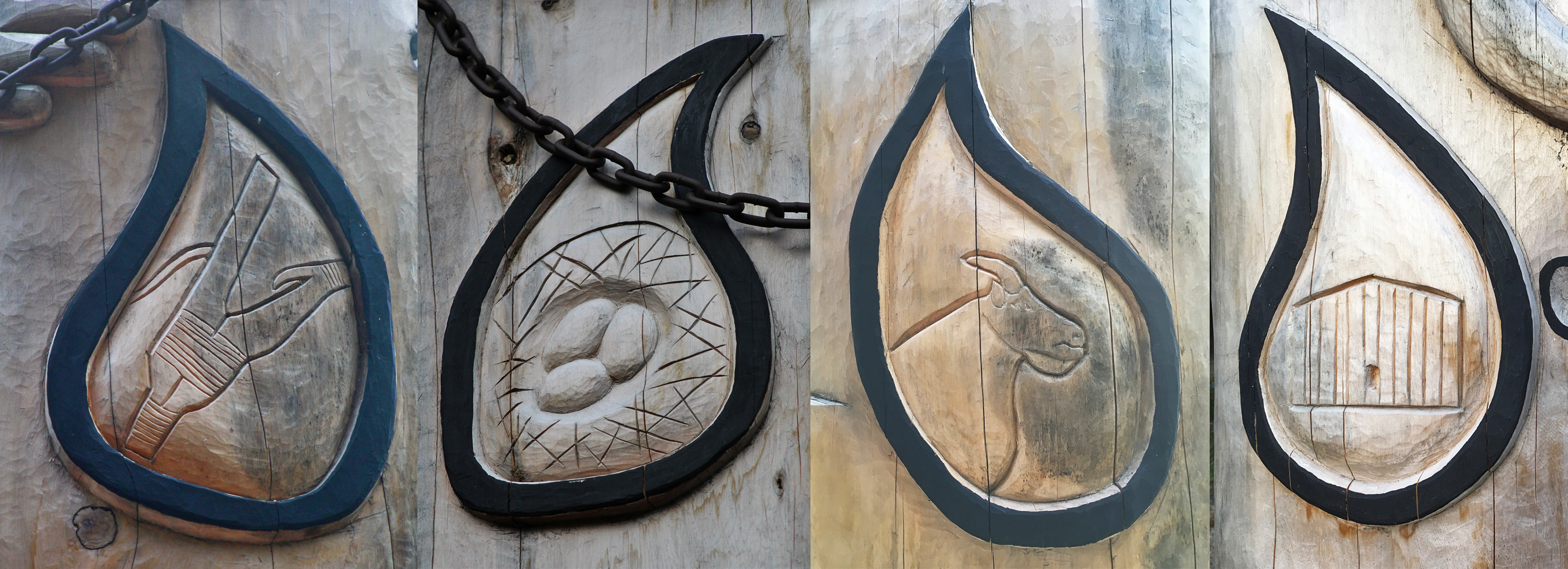 tears with various details carved into a totem pole