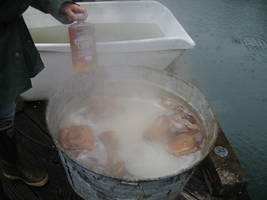 Simmering bones at a constant temperature to coax oil out of bones