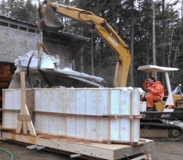 Removing the enormous skull from the tank