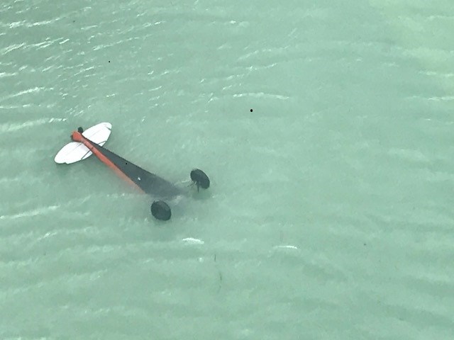 7.18PlaneInCrillonLake Plane partially submerged, upside-down, in a lake