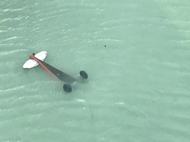 7.18PlaneInCrillonLake Plane partially submerged, upside-down, in a lake