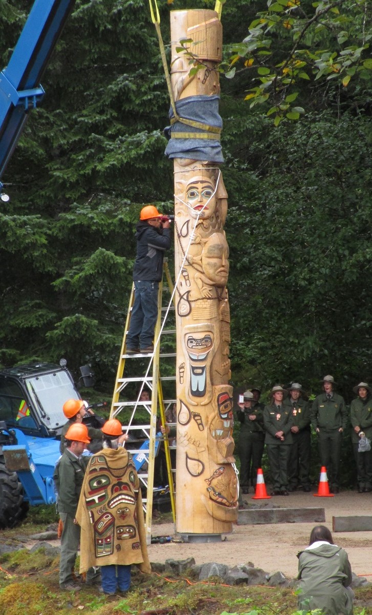 Totem pole being raised