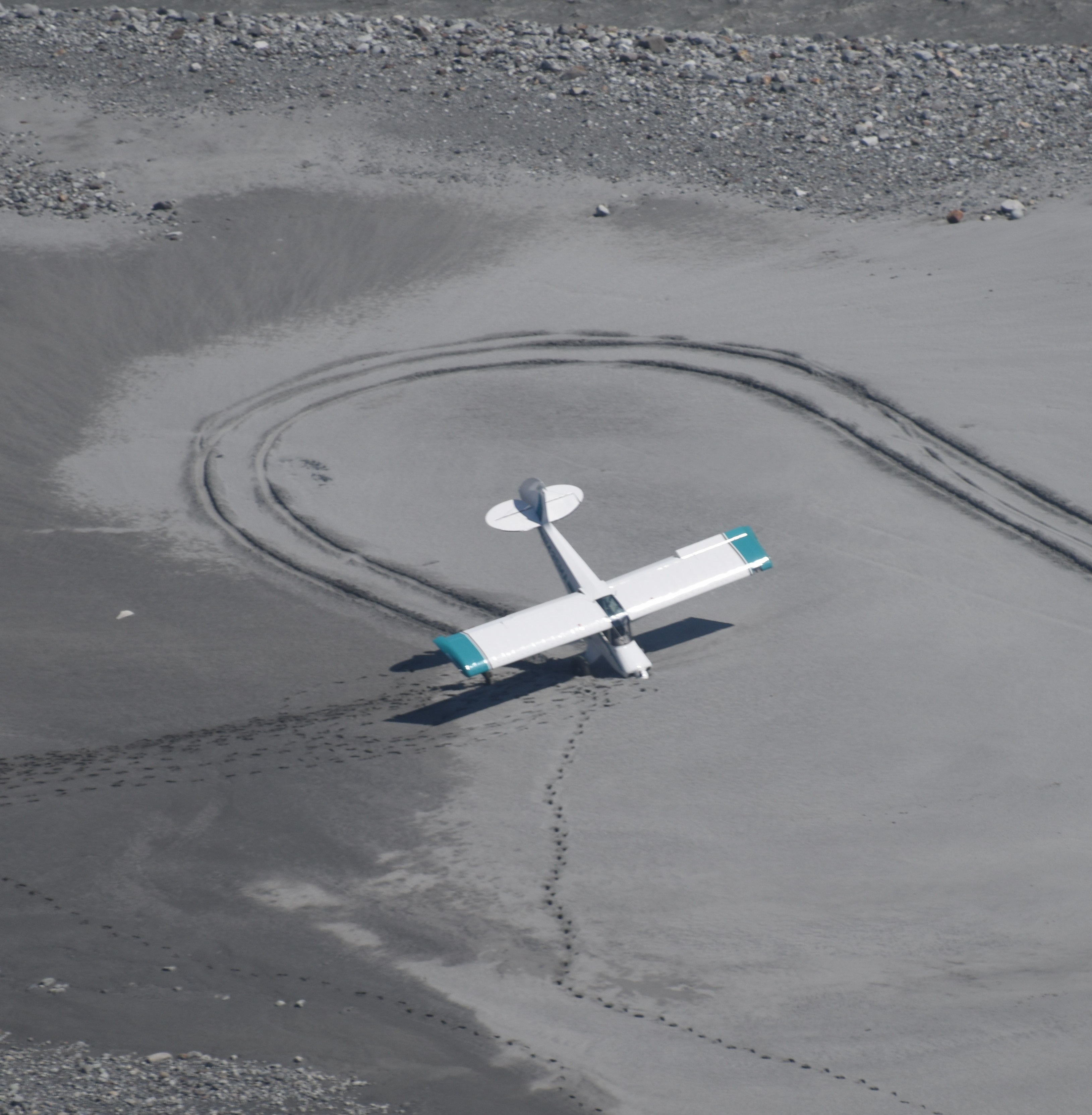Small plane on its nose in sand