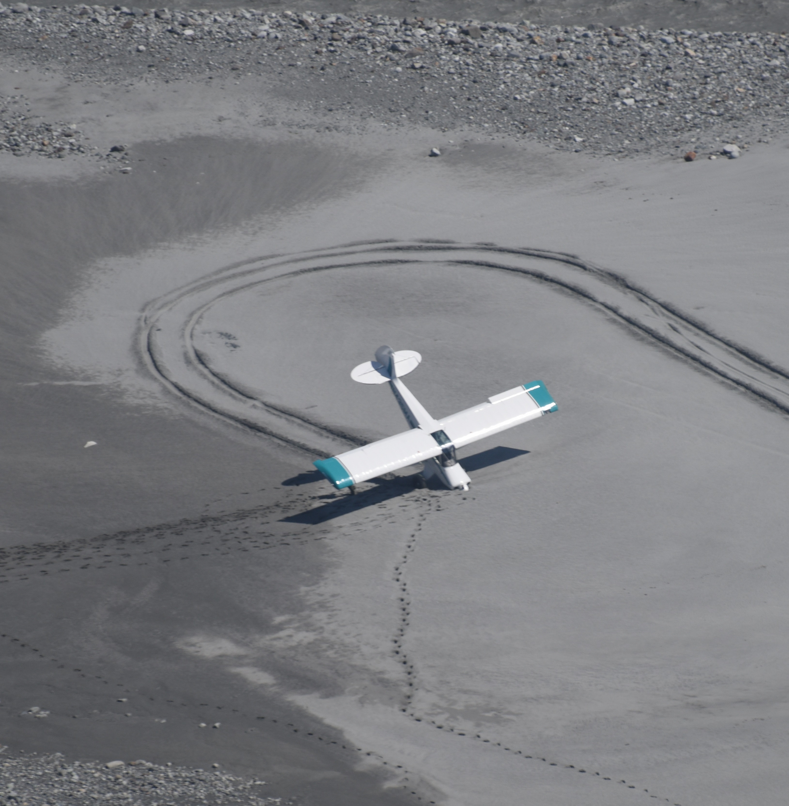 Aircraft_GrandPacific Small plane on its nose in sand