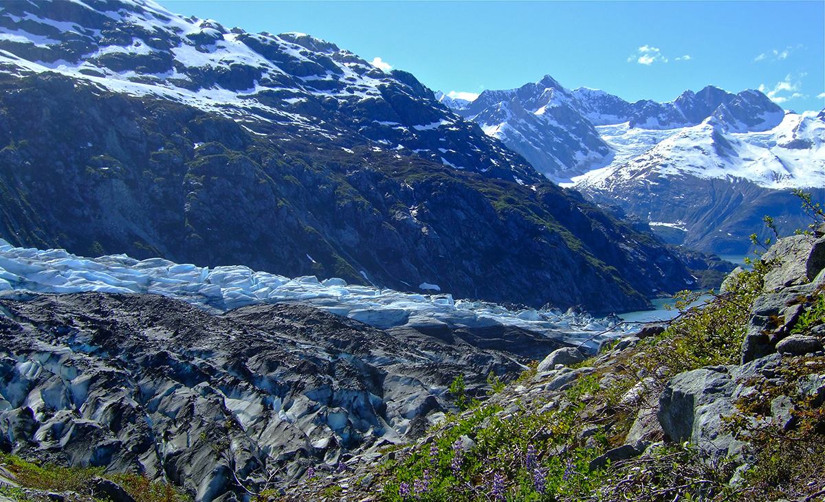 Glacier surface with mountains behind