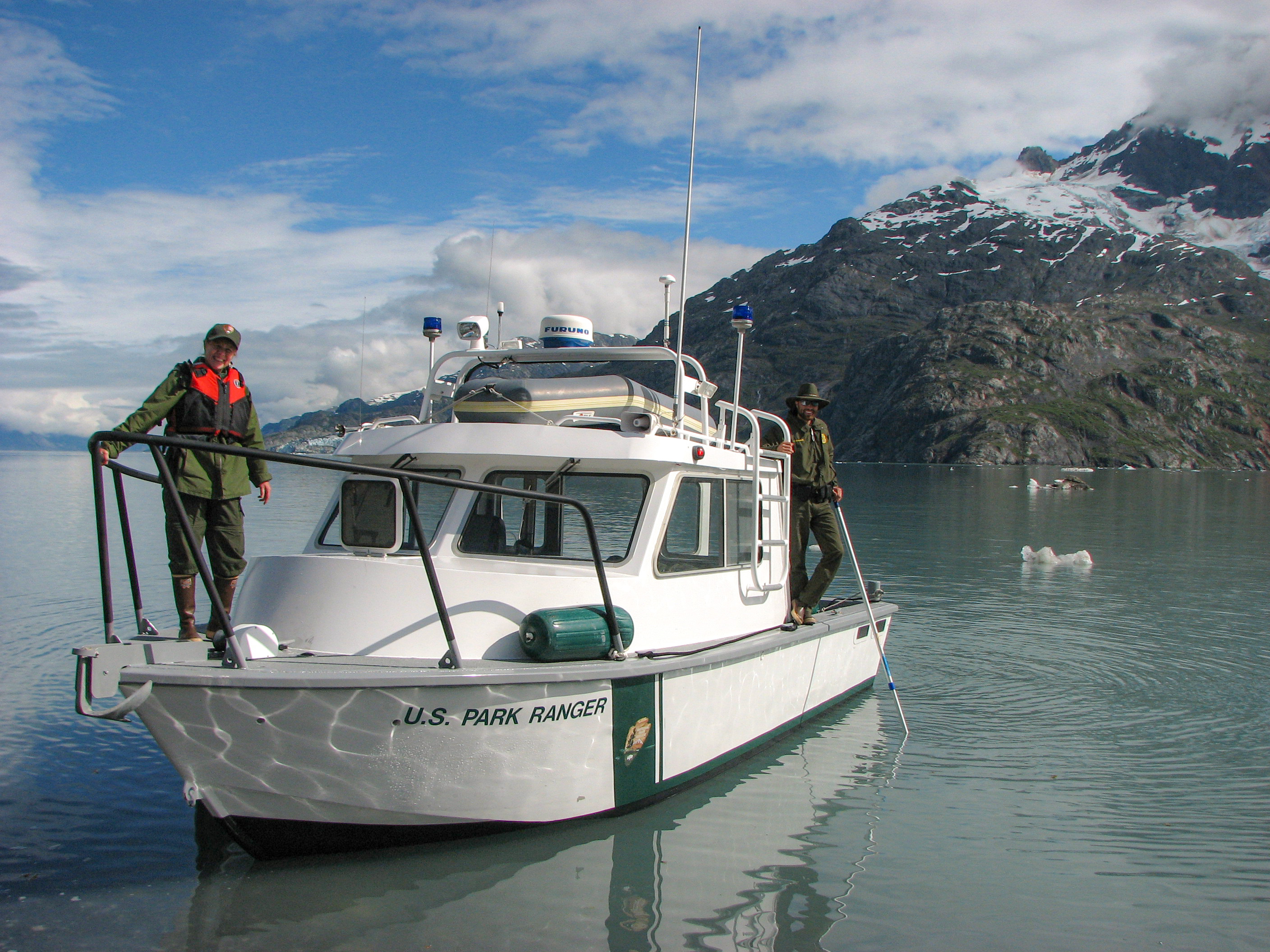 two rangers on a patrol boat in glacier bay