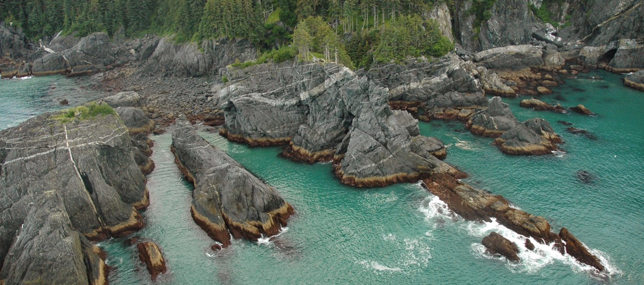 a rocky coastal area with turquoise waters