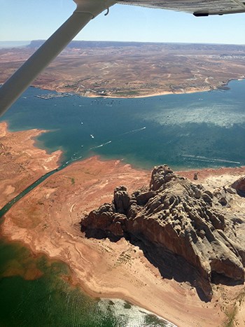 Aerial view looking down on Castle Rock Cut and busy Wahweap Bay