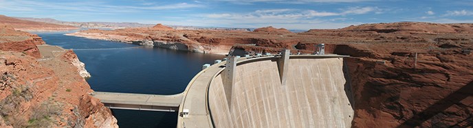 Long view of Glen Canyon Dam and lake Powell behind it. Long view of Glen Canyon Dam and lake Powell behind it.