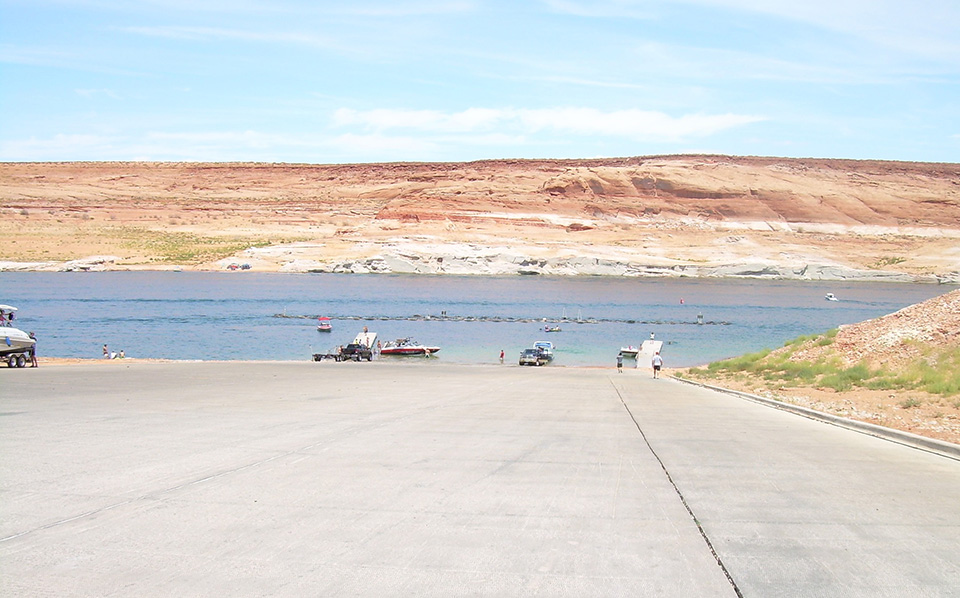 Antelope Point Public Launch Ramp Paved launch ramp leading to lake, boats and cars on the sides and launching
