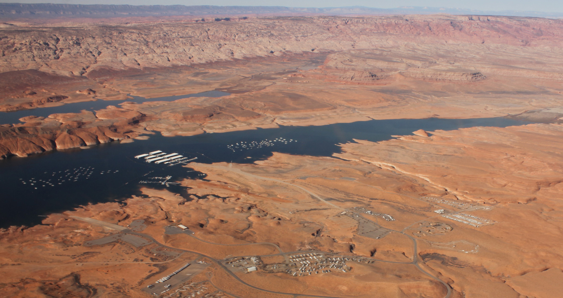 Aerial view over lake, marina, sandstone