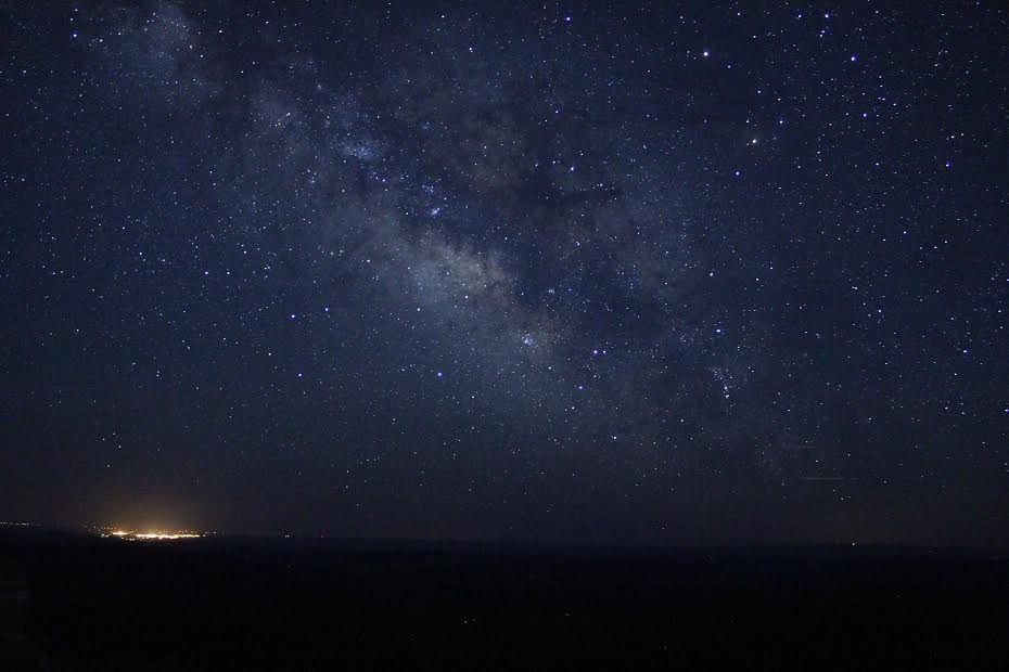 Night sky with city glow at the bottom.