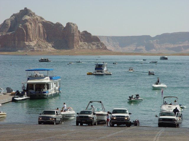 View from Wahweap boat ramp showing a busy day with boats of all sizes launching and operating on Lake Powell