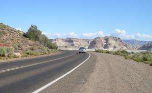 Wahweap Road road with car driving away