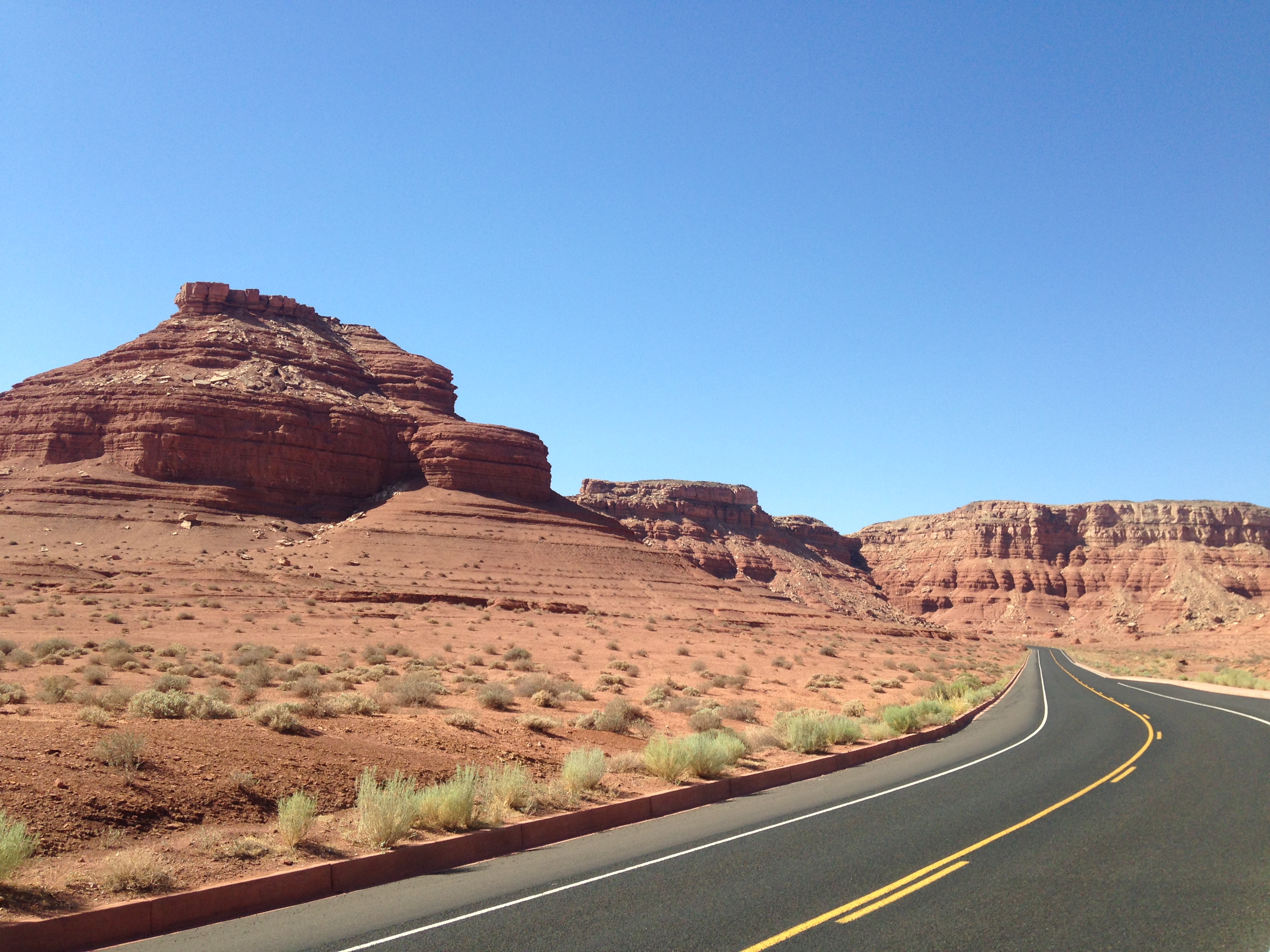 Paved road winding though red cliffs at Lees Ferry.