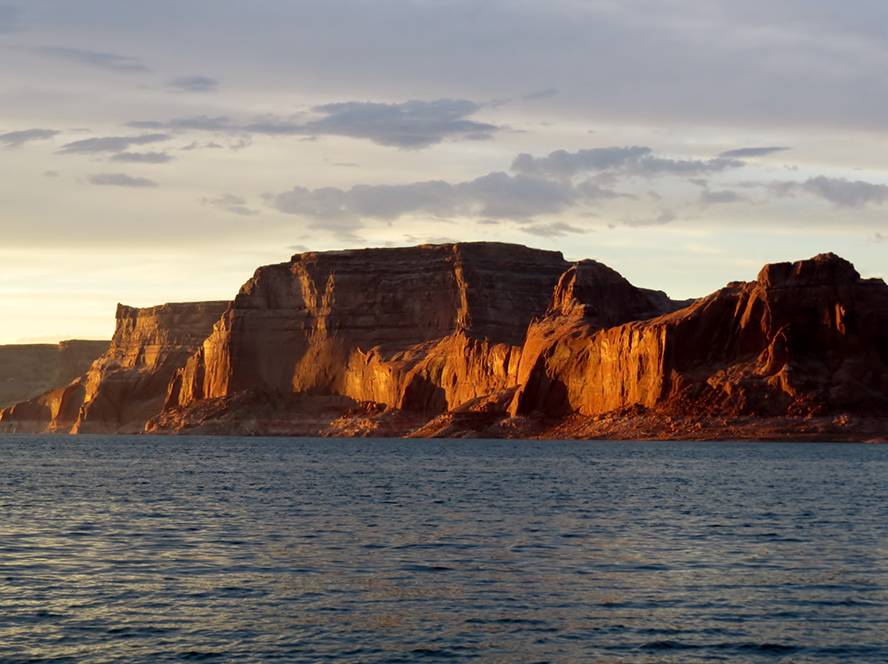 Large sandstone butte surrounded by water