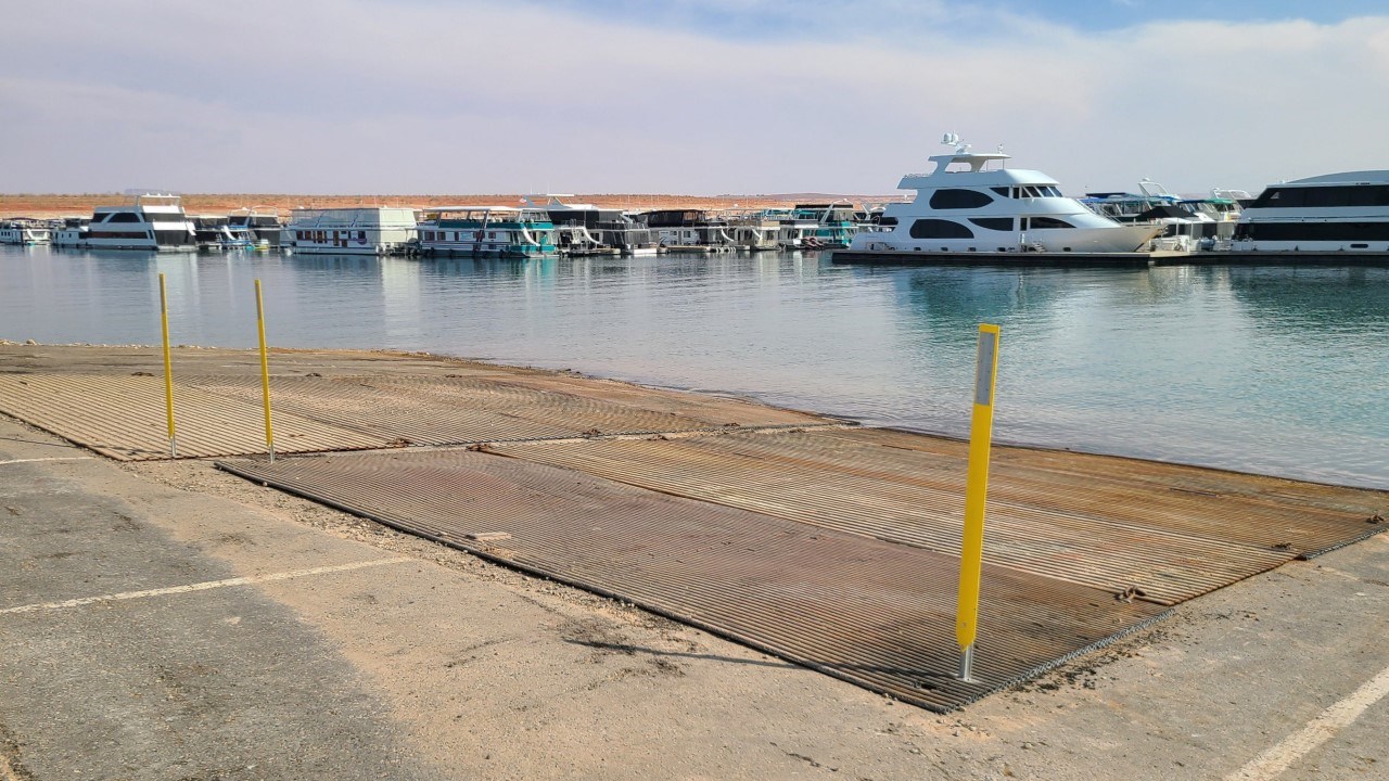 Wahweap Auxiliary Ramp August 11 2021 launch ramp and metal plates at water's edge.