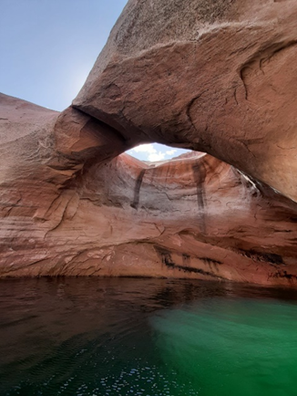 double arch in Rock Creek Natural sandstone ach over a desert lake