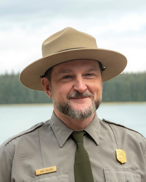 Jake Ohlson Headshot 2023 Park Ranger smiles for a headshot