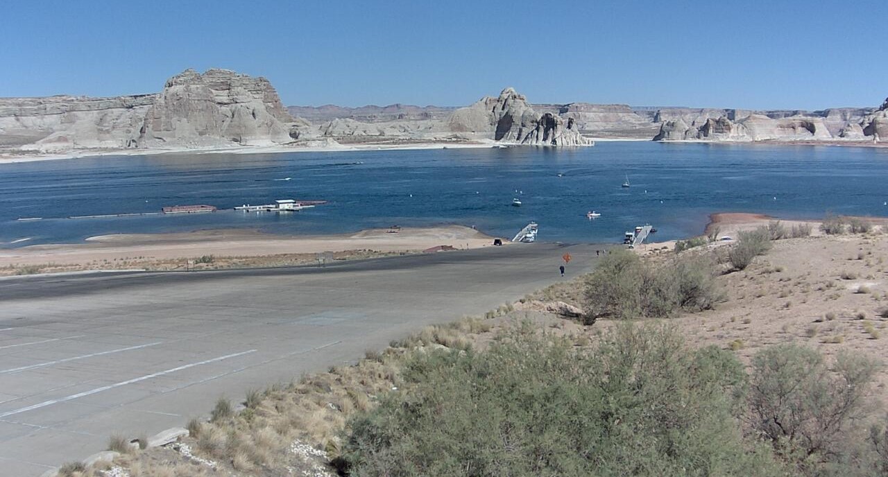 Long concrete ramp leading to Lake Powell. Sandstone cliffs in background.