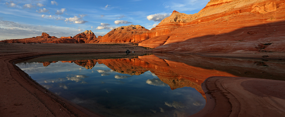 Sandstone cliffs and blue water