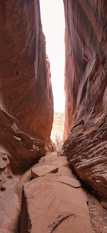 Narrow canyon with bright exit