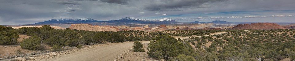 Panoramic view of five dark mountains