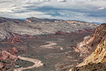Dry creek bed in large wide canyon