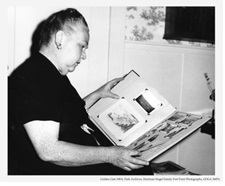 James Rankin's grandaughter Meriam, looking through her family's album.