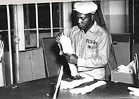 Photo of African American Alcatraz inmate working in the laundry