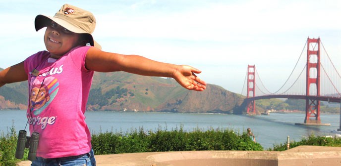 Young visitor in front Golden Gate Bridge Young visitor in front Golden Gate Bridge