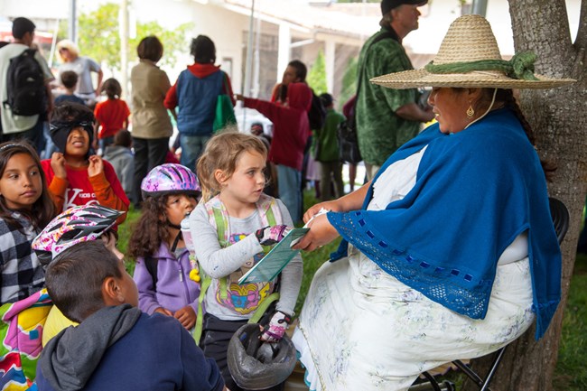 Volunteerwithchildren Volunteer interacts with children.