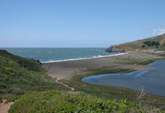 View of the Pacific Ocean, Rodeo Lagoon and barrier beach from the lagoon trail View of the Pacific Ocean, Rodeo Lagoon and barrier beach from the lagoon trail