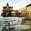 colored postcard showing large decorative building on bluff overlooking ocean