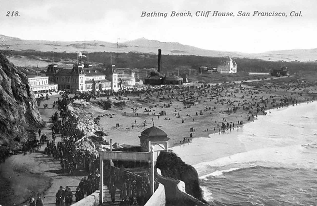 historic postcard showing long, crowded beach with amusement park buildings in the background. historic postcard showing long, crowded beach with amusement park buildings in the background.