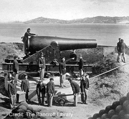 photo of soldier and a mounted Rodman gun on Alcatraz Island