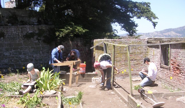 people working outside with tools