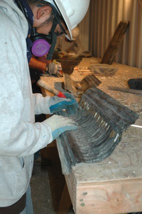 workers removing paint from historic metal ceilings