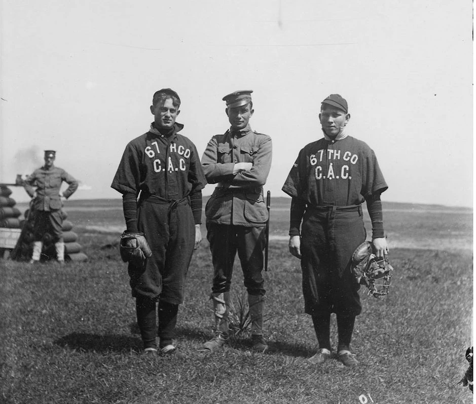 soldiers in old fashioned baseball uniforms holding catcher's mitts soldiers in old fashioned baseball uniforms holding catcher's mitts