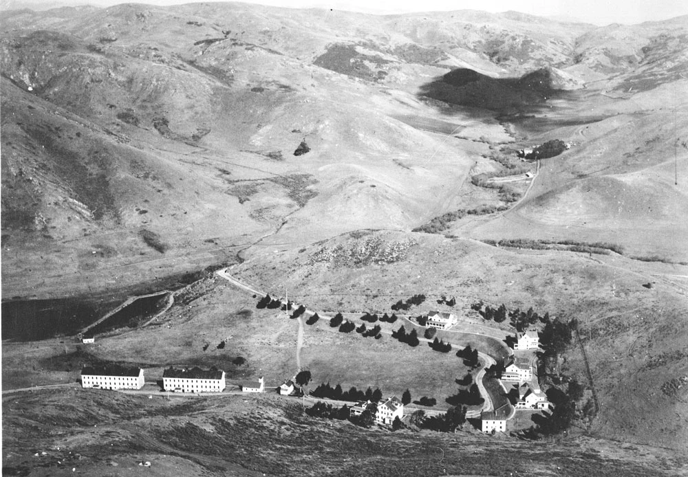 GOGA-2880-Fort-Barry-Aerial-1928 white buildings clustered in a row in a rural setting