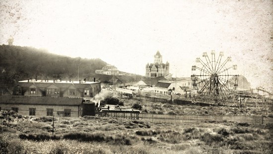 historic photos of ferris wheel, low buildings and decorative Cliff House