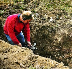 man standing in deep trench