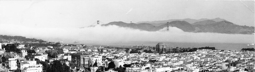 compact city blocks with fog and water in background compact city blocks with fog and water in background
