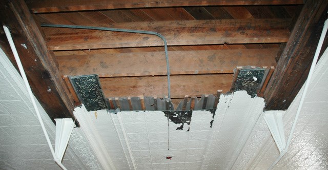 exposed ceiling beams with painted panels