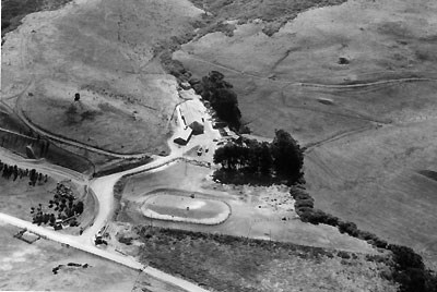 birds eye view of farm clustered in valley