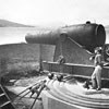 Civil War Alcatraz soldier standing at cannon overlooking San Francisco Bay