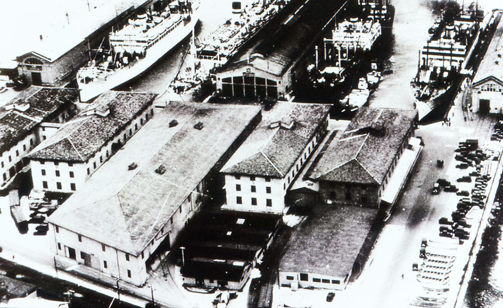 large warehouse buildings situated closely near waterfront