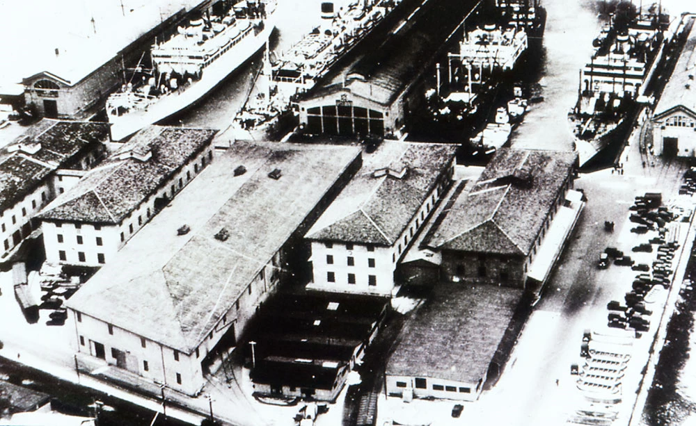 SF-Port-of-Embarkation-FM042 large warehouse buildings situated closely near waterfront