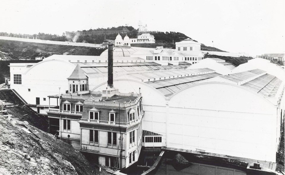 large white glass buildings near water