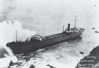 Waves crashing over the end of a large boat.